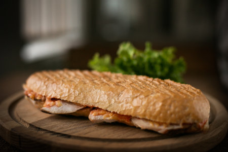 Sandwich open with ham cheese and tomato vegetable on wood background, top view, copy space, breakfast food concept.の写真素材