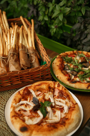 Delicious pizza Breadsticks grissini served on wooden table. Italian cuisine concept traditional pizza recipe.の写真素材