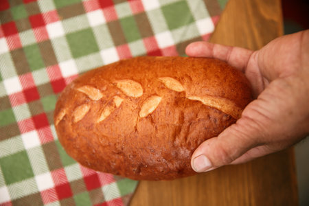 Closeup image of hands holding homemade sourdough bread, Craft authentic bread and Home Cooking...