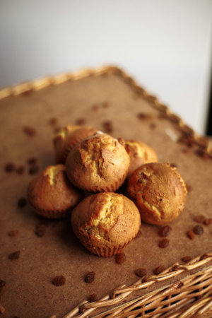 Muffin with raisins as small cake home made on wooden tableの写真素材