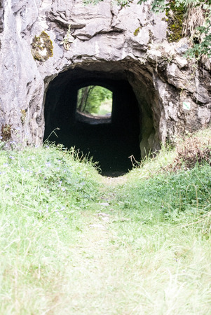 tunnel through limestone rock in former Kobyla quarry near Koneprusy Cave in Cesky kras in Central Bohemiaの写真素材