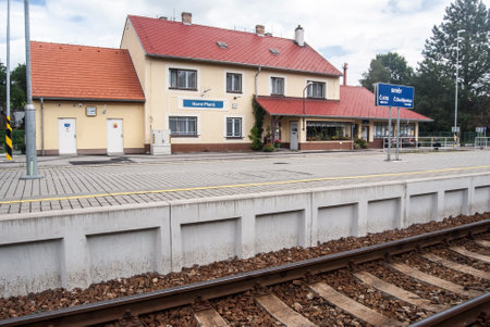 railway station building with platform and track in Horni Plana near Lipno water reservoir in South Bohemiaのeditorial素材