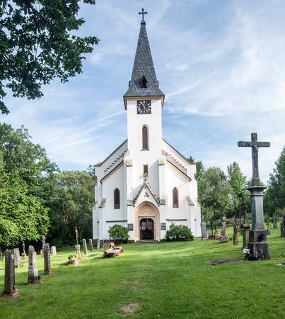 church with cemetery in former village Zadni Zvonkova in Sumava mountains near Lipno water reservoirの写真素材