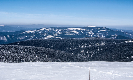 winter Jeseniky mountains panorama with Dlouhe Strane hill, snow and clear sky from Praded hillの写真素材