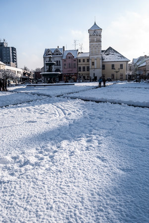 Masarykovo namesti square with town hall and fountain in Karvina city in Czech republic during winter day with snow and clear skyのeditorial素材