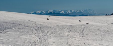 amazing panorama of Tatra mountains from Lzcanska Mala Fatra mountains bellow Veterne hill in Slovakia during winter day with clear skyの写真素材