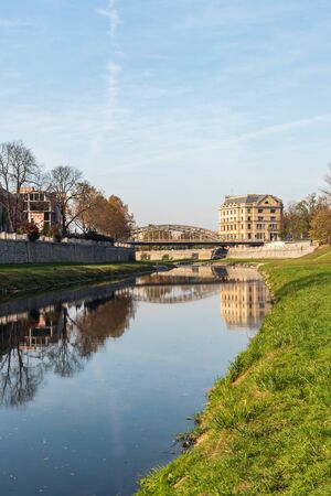 Ostravice river with Most Milose Sykory bridge in Ostrava city in Czech republic during nice autumn dayの写真素材