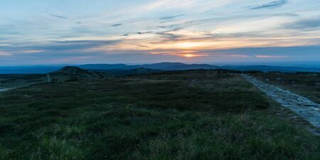 view from Vysoka plan hill in Krkonose mountains on czech-polish border during summer sunsetの写真素材