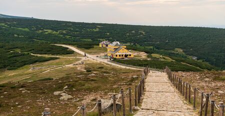 Obri sedlo mountain pass bellow Snezka hill with Dom Slaski hut in Krkonose mountains on...