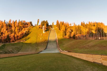ski jumping hills on Strbske Pleso in Vysoke Tatry mountains in Slovakia during beautiful autumn morningの写真素材