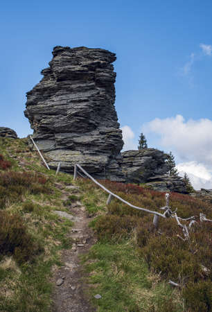 Vozka hill with rock formations and hiking trail in Jeseniky mountains in Czech republicの写真素材