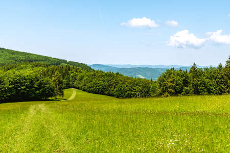 Springtime Bile Karpaty mountains scenery with mix of meadows, forest and hills on czech - slovakian borders bellow Kosak hillの写真素材