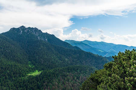 View from Maly Rozsutec hill in Mala Fatra mountains in Slovakia with rocky Velky Rozsutec hill and other hills of Mala Fatra mountainsの写真素材
