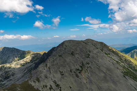 Varful Papusa with few other peaks from Varful Peleaga mountain peak in Retezat mountains in Romania...