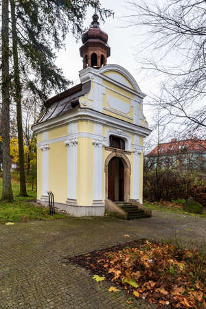 Chapel near Kostel Nejsvetejsi Trojice in Novy Jicin city in Czech republic during cloudy late autumn dayの写真素材