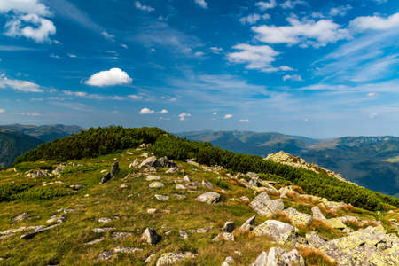 Amazing view from Varful Zlata hill summit above Zanoaga lake in Retezat mountains in Romania with...