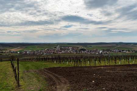 Schrattenberg village with rural landscape around in Lower Austria near borders with Czech republic during partly cloudy springtime dayの写真素材