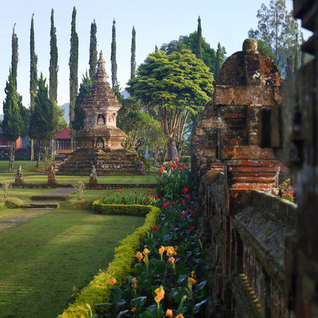 Buddhist stupa in gardens of Pura Ulun Danu temple on a lake Bratan, Bali, Indonesiaの写真素材