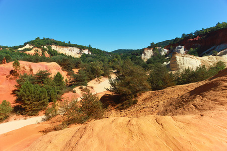 Colored red and yellow ochre mountains and quarries in Rousillon. Provence, France.の写真素材
