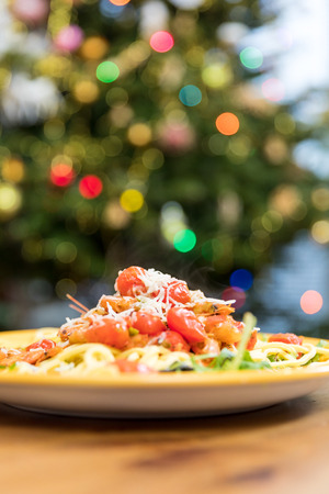 Pasta with prawns cherry tomatoes and parmesan cheeseの写真素材