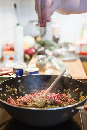 minced meat preparation and cooking in pan for lasagna bolognese ragoutの写真素材