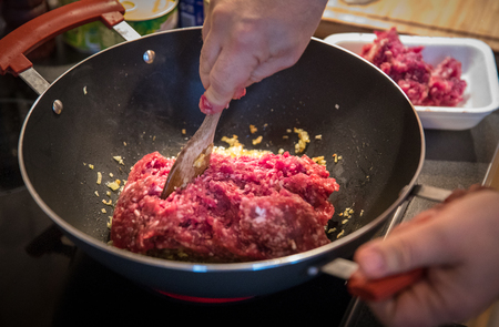 minced meat preparation and cooking in pan for lasagna bolognese ragoutの写真素材