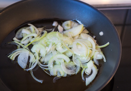 onion with olive oil in the panの写真素材