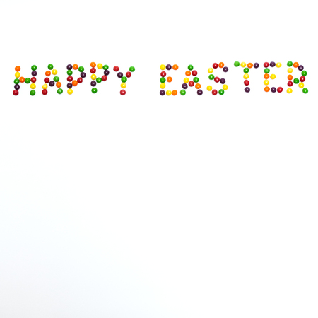 Happy Easter sign made of colour lentil candies