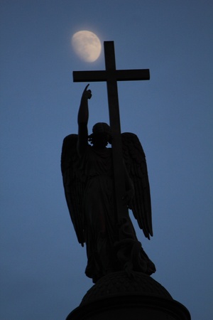Angel pointing on the moonの写真素材