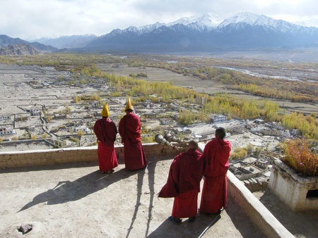 Buddhist monks blow the horn before morning services in over the Indus valley in Ladakh, Indian Himalaya, Tikse monastery のeditorial素材