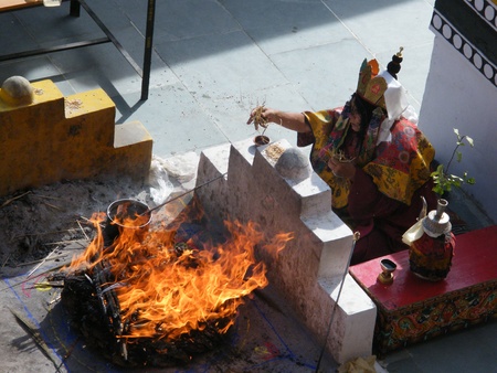 Mandala celebrations - buddhist monk in ritual with fire in Tikse monastery in Himalaya, Ladakh のeditorial素材