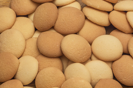 Sponge biscuits scattered on table.の写真素材