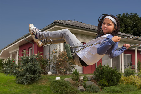 Happy child girl playing at new family house.の写真素材