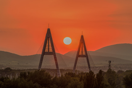 Sunset on a modern Megyiery bridge in Budapest, Hungary over Danube. The industrial view.の写真素材