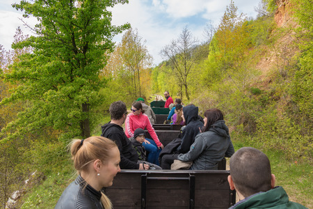 Prague, Czech Republic - May 01, 2017: people enjoying holiday time and drive in a small historical train in the nature park called Cesky Kras near Karlstein, a favorite relaxing place for Prague citizens.のeditorial素材