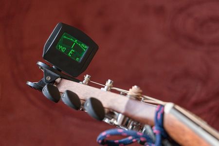 Tuning the guitar, e stringの写真素材