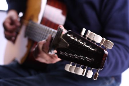 playing on the guitar