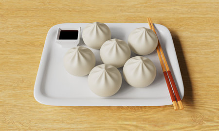 Steamed dumplings on a white plate with chopsticks.の写真素材