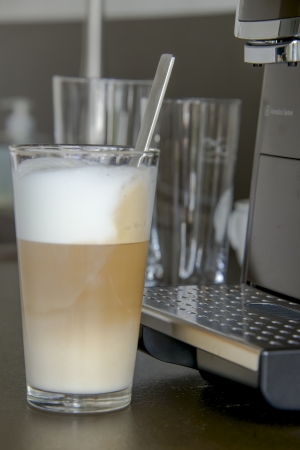 a glas of fresh prepared latte macchiatoの写真素材