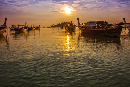 Silhouette sea sunlight fishboatの写真素材