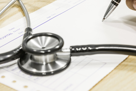 blur stethoscope on prescription select focus of penの写真素材