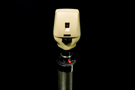 ophthalmoscope in black shadowの写真素材