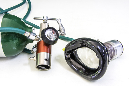 oxygen cylinder regulator and mask with demand valve isolatedの写真素材