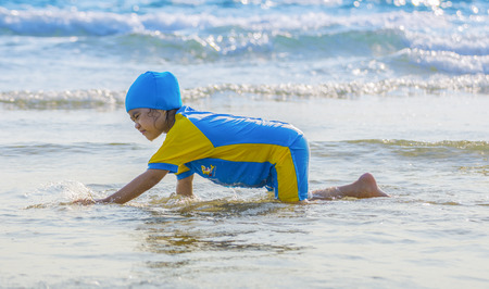 children playing on the beachの写真素材