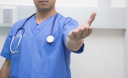 men doctor show hand stetoscope on the neckの写真素材