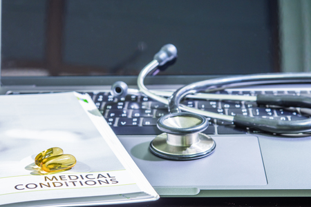 pills color yellow on the medication book concept healthcareの写真素材