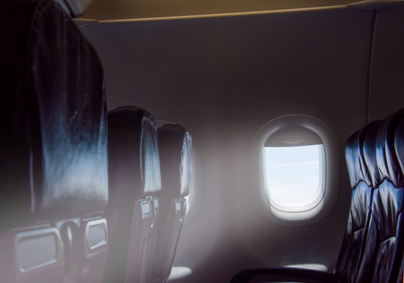 light the sun in windows on airplane dark toneの写真素材