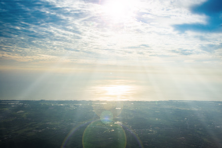 fluffy cloud on the sky and flare sunset timeの写真素材