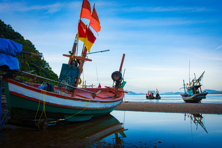 Fishing boat on the beach seascape in Thailand dark toneの写真素材