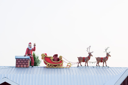 santaclaus and reindeer on roof concept holidayの写真素材
